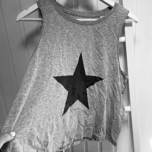 Grey star vest  (size 10- 12)