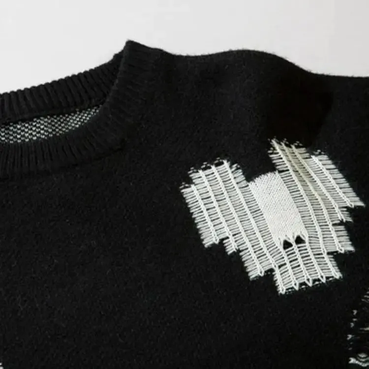 Grunge Sweater with Distressed Details and Contrast Color Heart Patterns